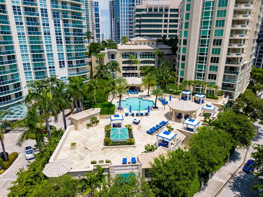 High-rise condominium towers around a pool terrace in Florida