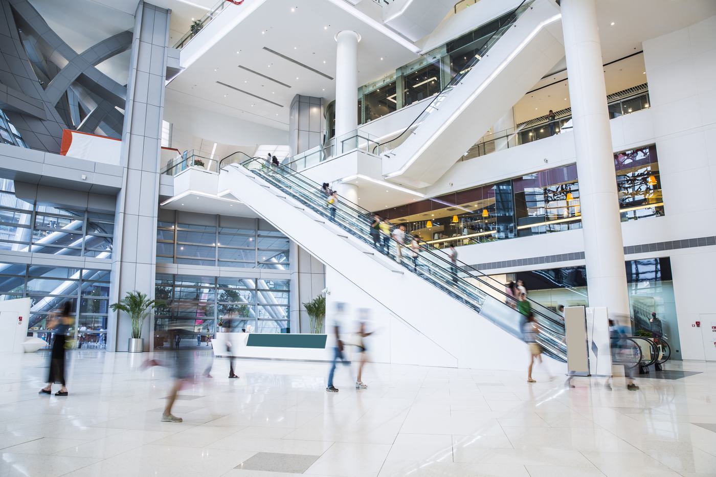 A multi-level shopping mall with escalators