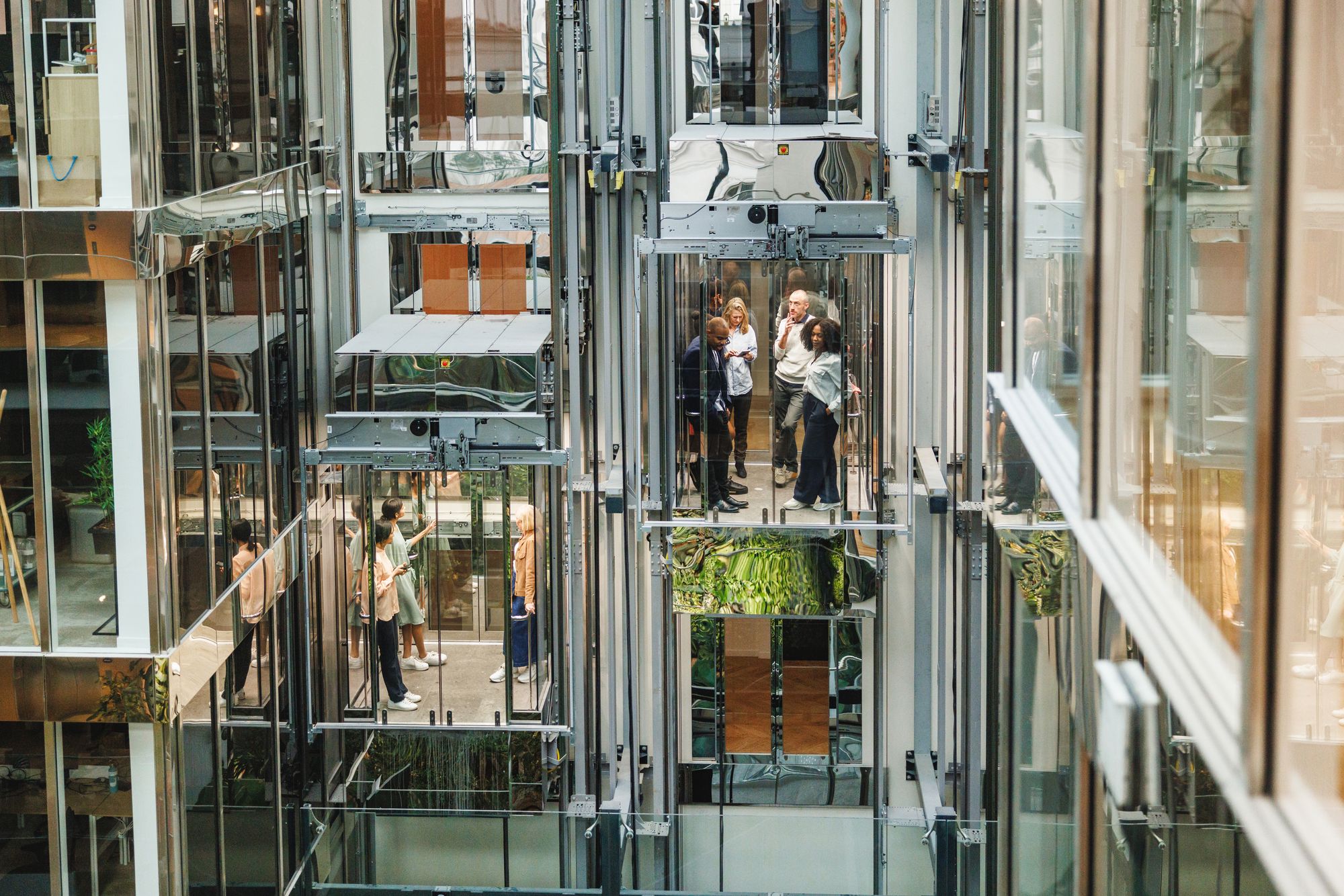Glass elevators rising through a corporate atrium